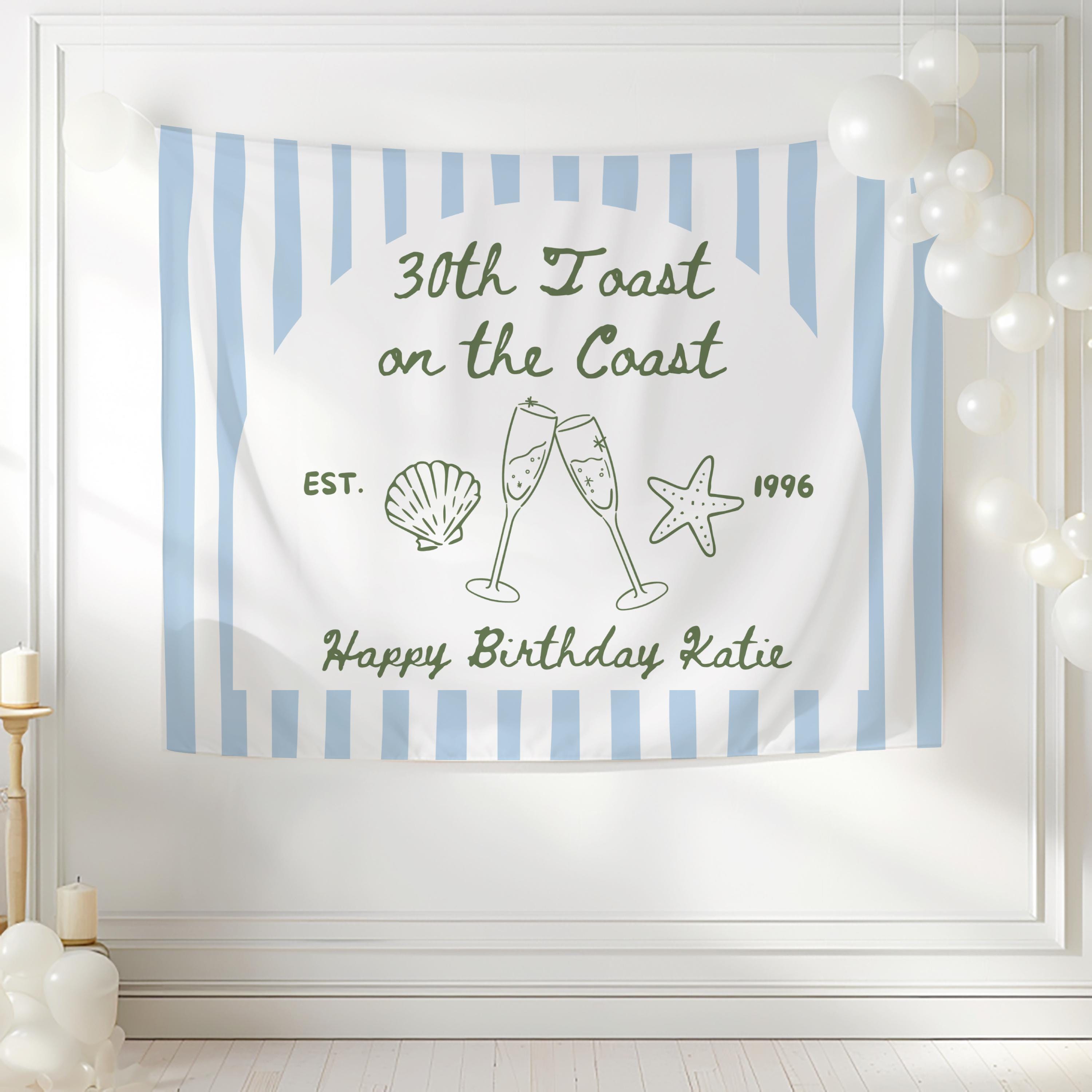 Custom 30th birthday party tapestry backdrop featuring Toast on the Coast theme with champagne glasses and beach inspired details