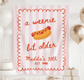 A Weenie Bit Older banner personalized for a fun hot dog themed birthday party
