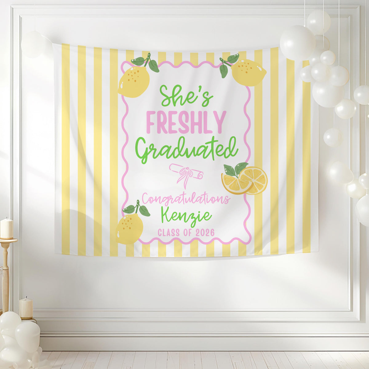 Colorful lemon graduation party backdrop with yellow stripes pink scalloped border and personalized graduation details
