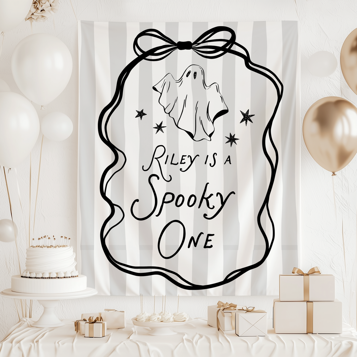 Spooky first birthday party backdrop for baby girl styled with black, white and pink Halloween birthday decorations
