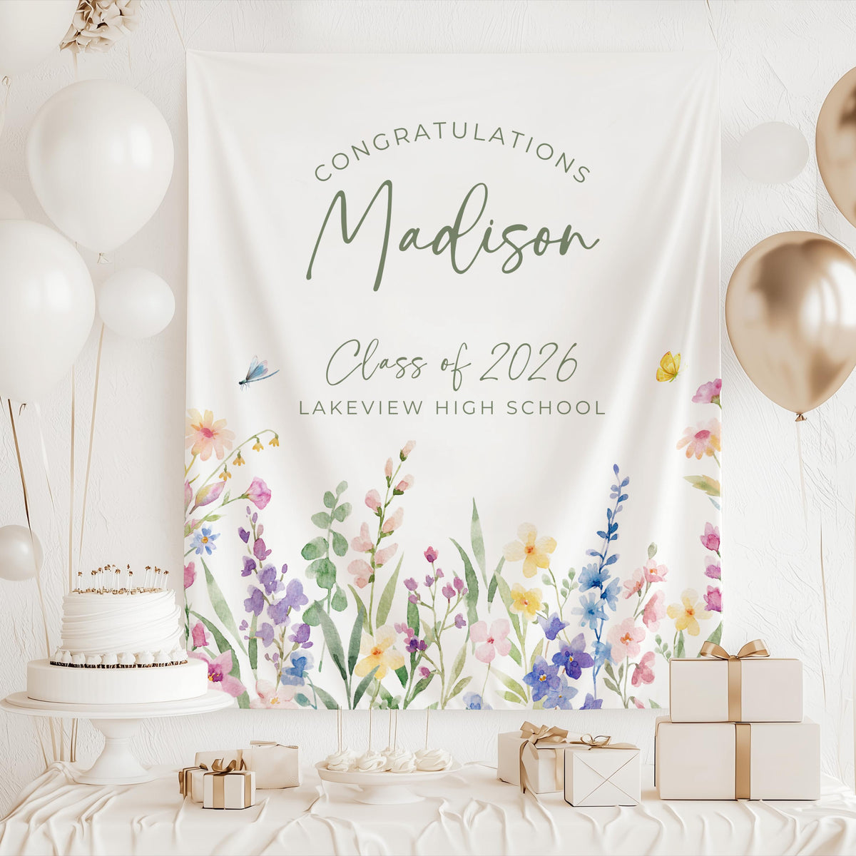Wildflower graduation party decor featuring a personalized floral banner with graduate name and school