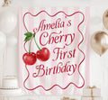 Personalized Cherry First Birthday banner with custom name and pink striped birthday backdrop