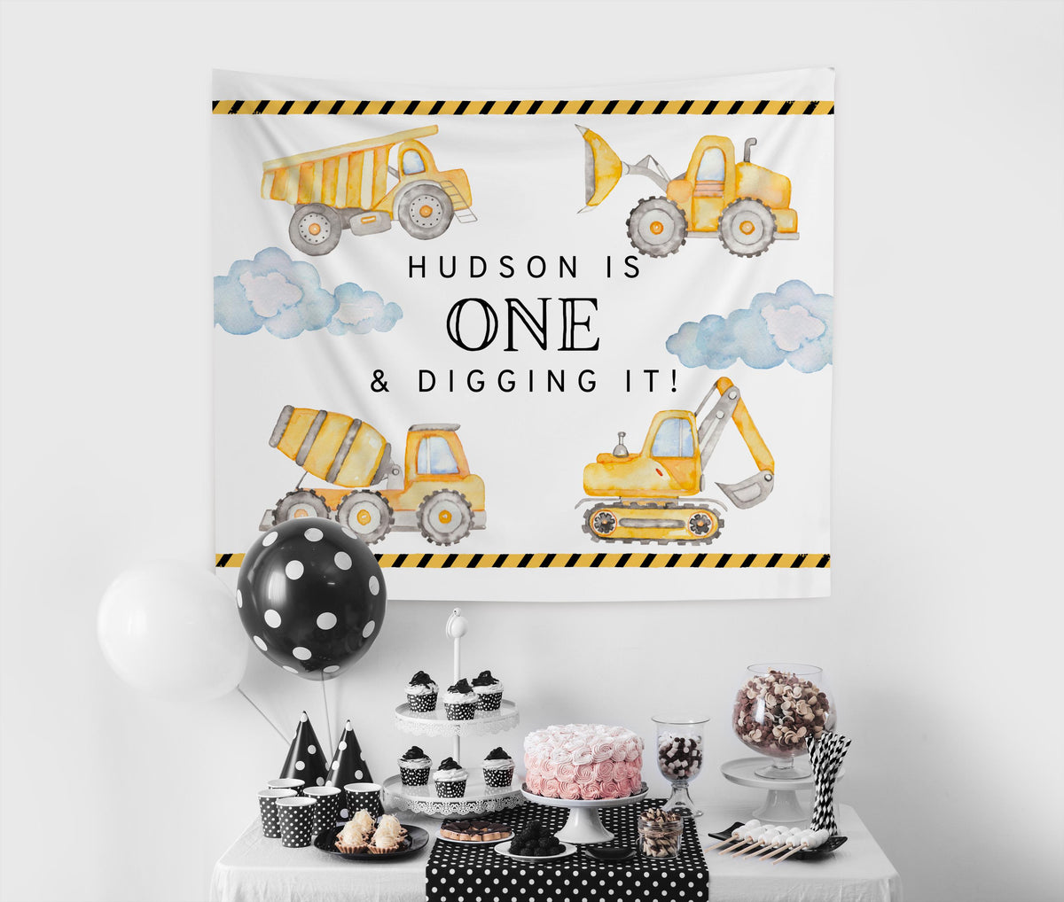 Custom construction birthday backdrop for cake table decorations and first birthday party photos
