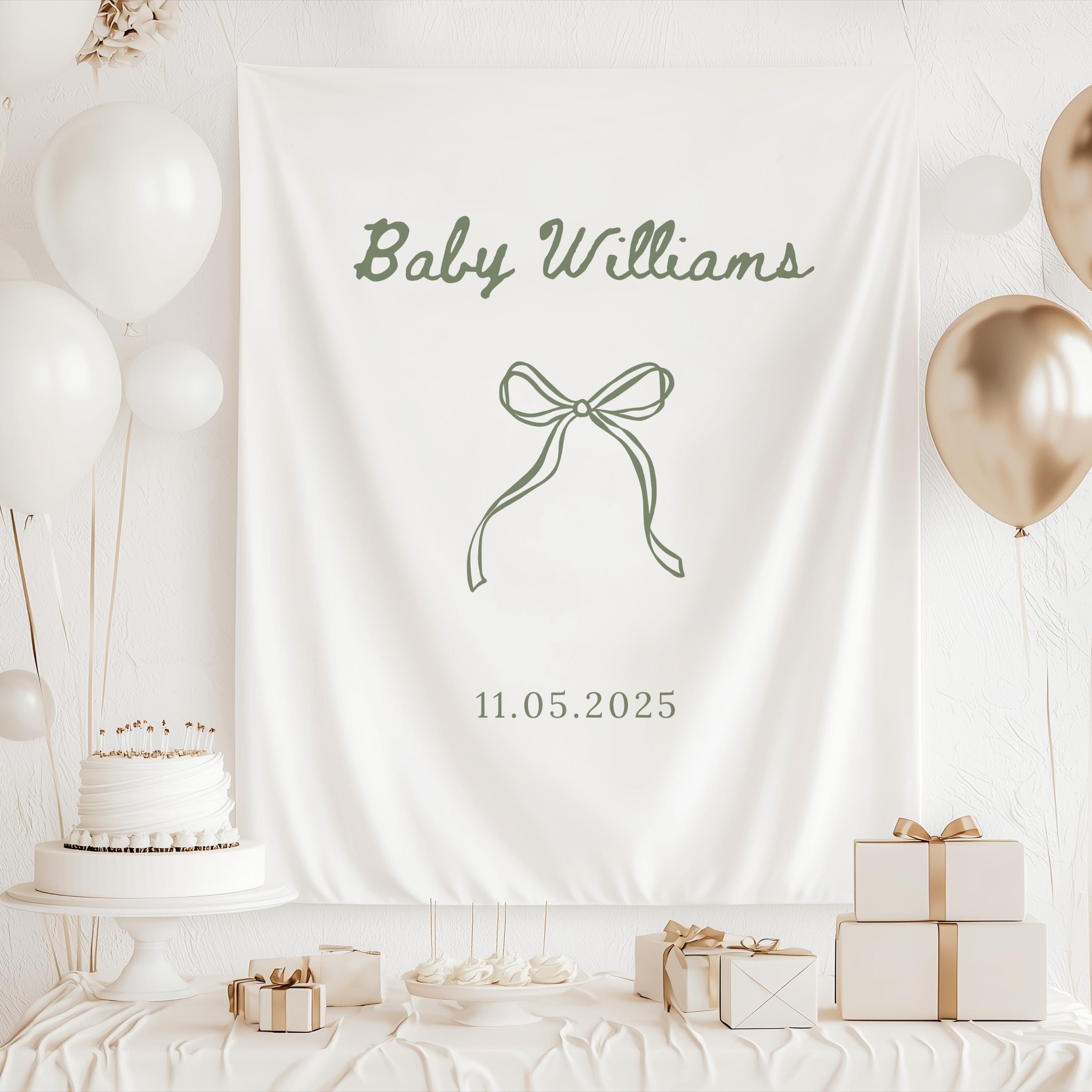 Minimalist baby shower backdrop personalized with baby's name in a timeless script design with a delicate bow illustration.