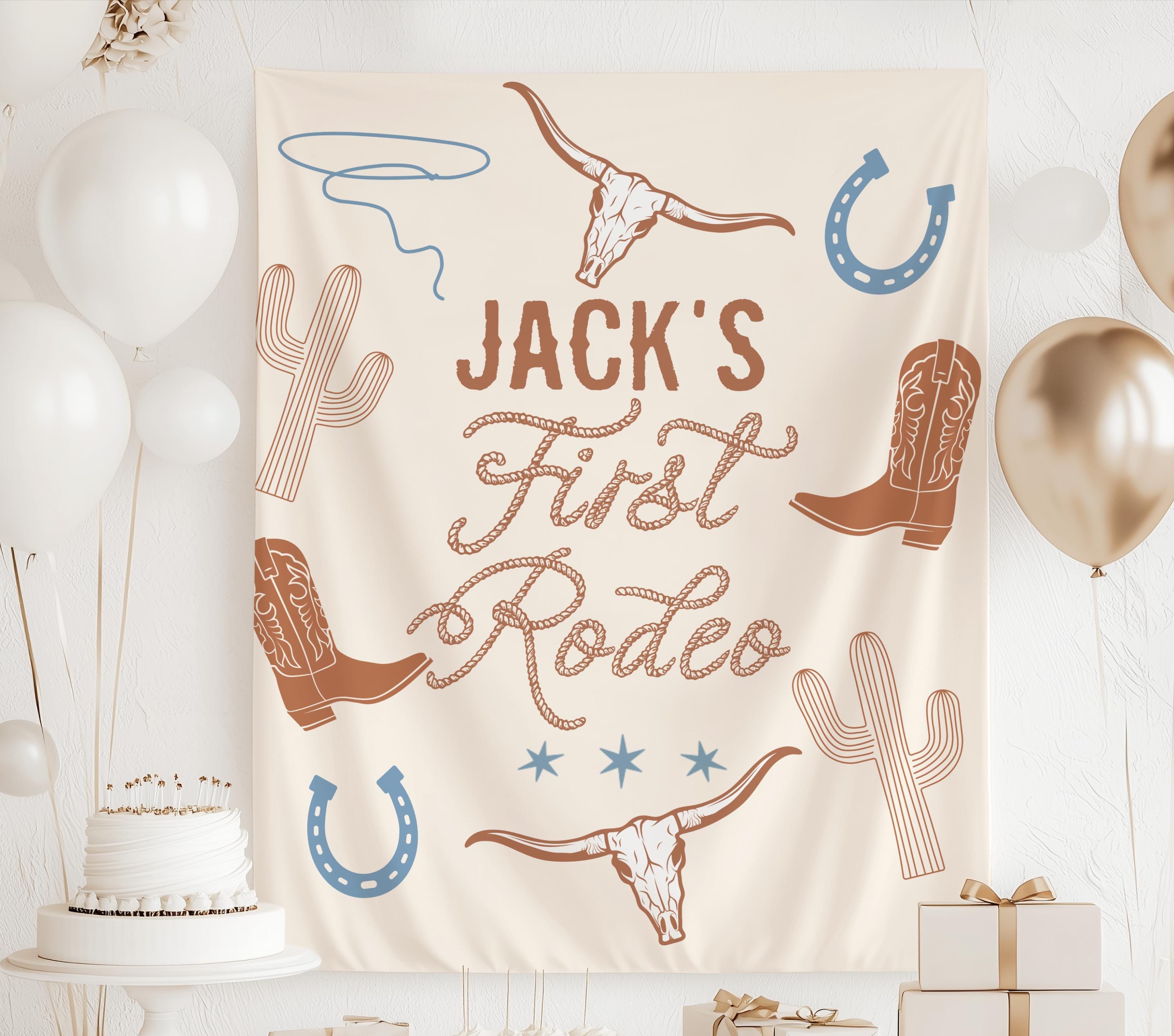 Custom First Rodeo 1st birthday banner featuring western cowboy party decorations