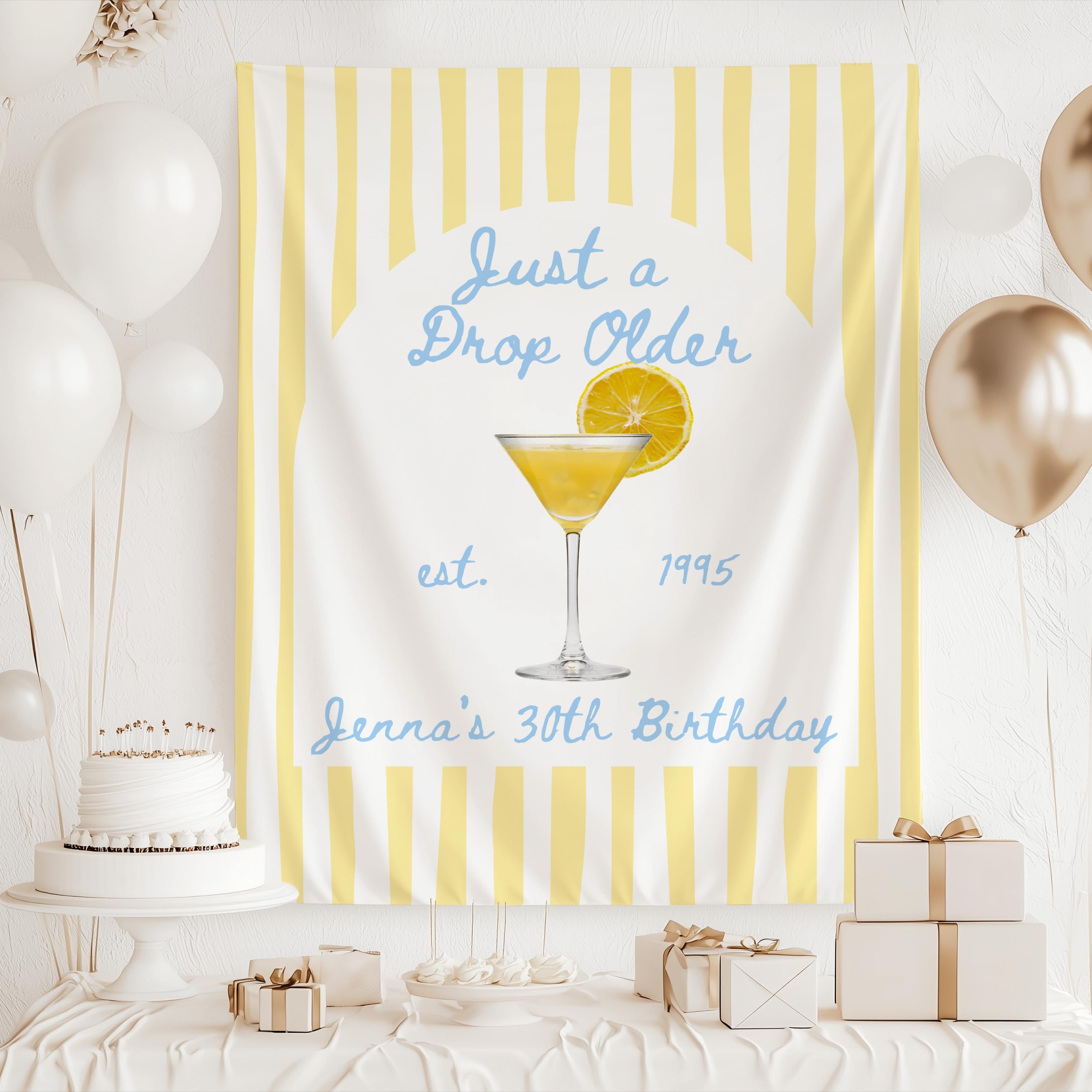 Cocktail themed birthday backdrop featuring lemon drop martini and personalized birthday wording
