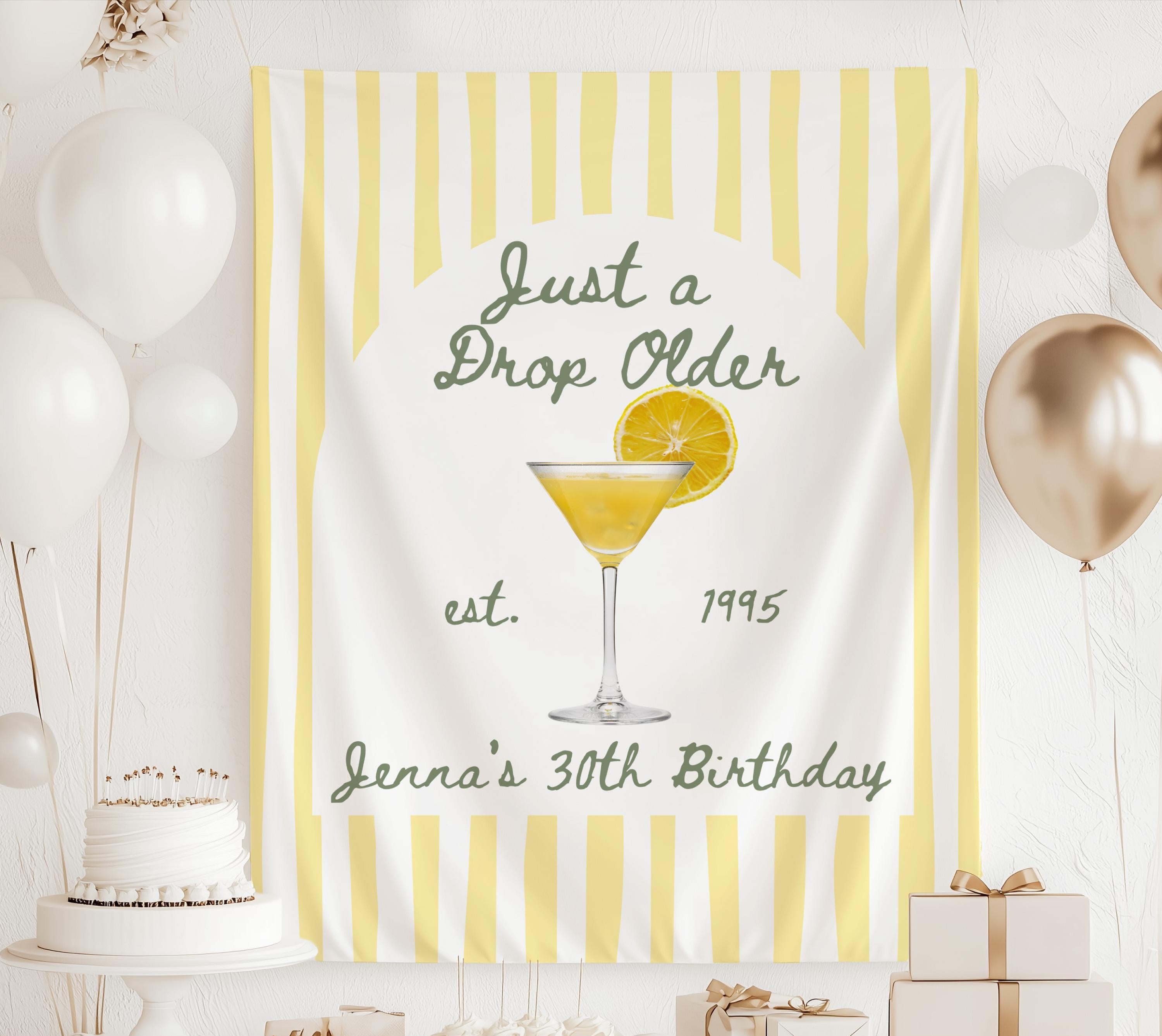 Just a Drop Older personalized birthday party backdrop with lemon drop cocktail illustration
