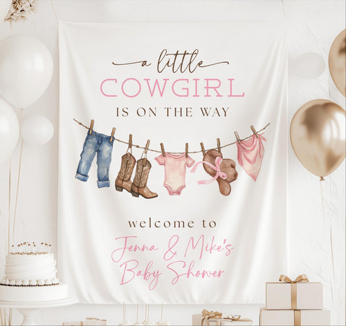 Personalized A Little Cowgirl Is on the Way baby shower banner with western baby girl clothes and cowboy boots