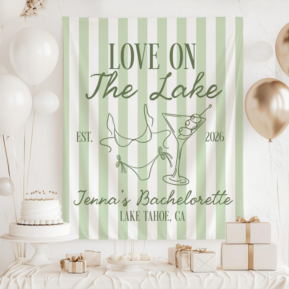 Custom Love on the Lake party backdrop featuring lake inspired artwork bikini martini glass and personalized bachelorette details
