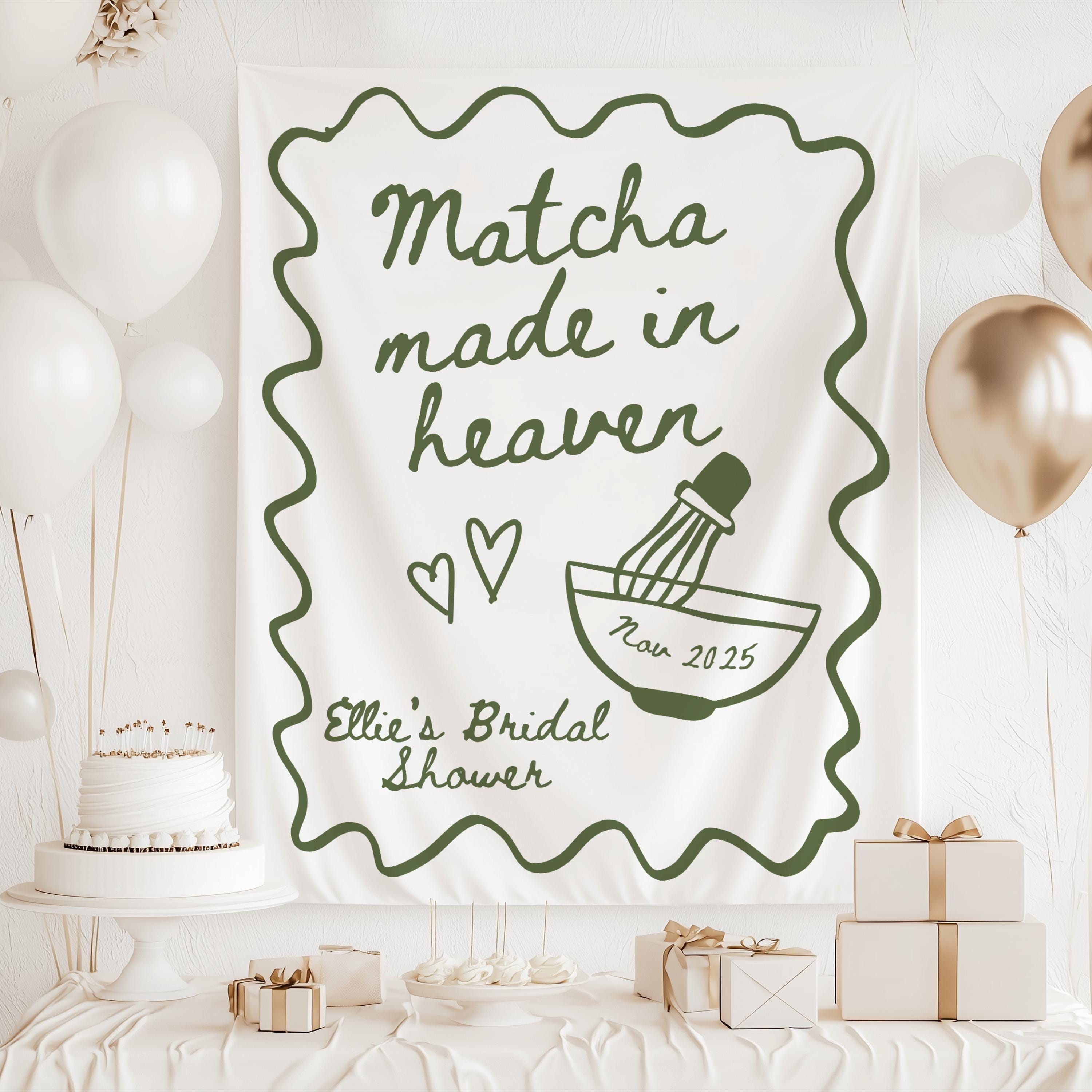 Matcha themed bridal shower backdrop featuring matcha bowl whisk and personalized bridal shower details
