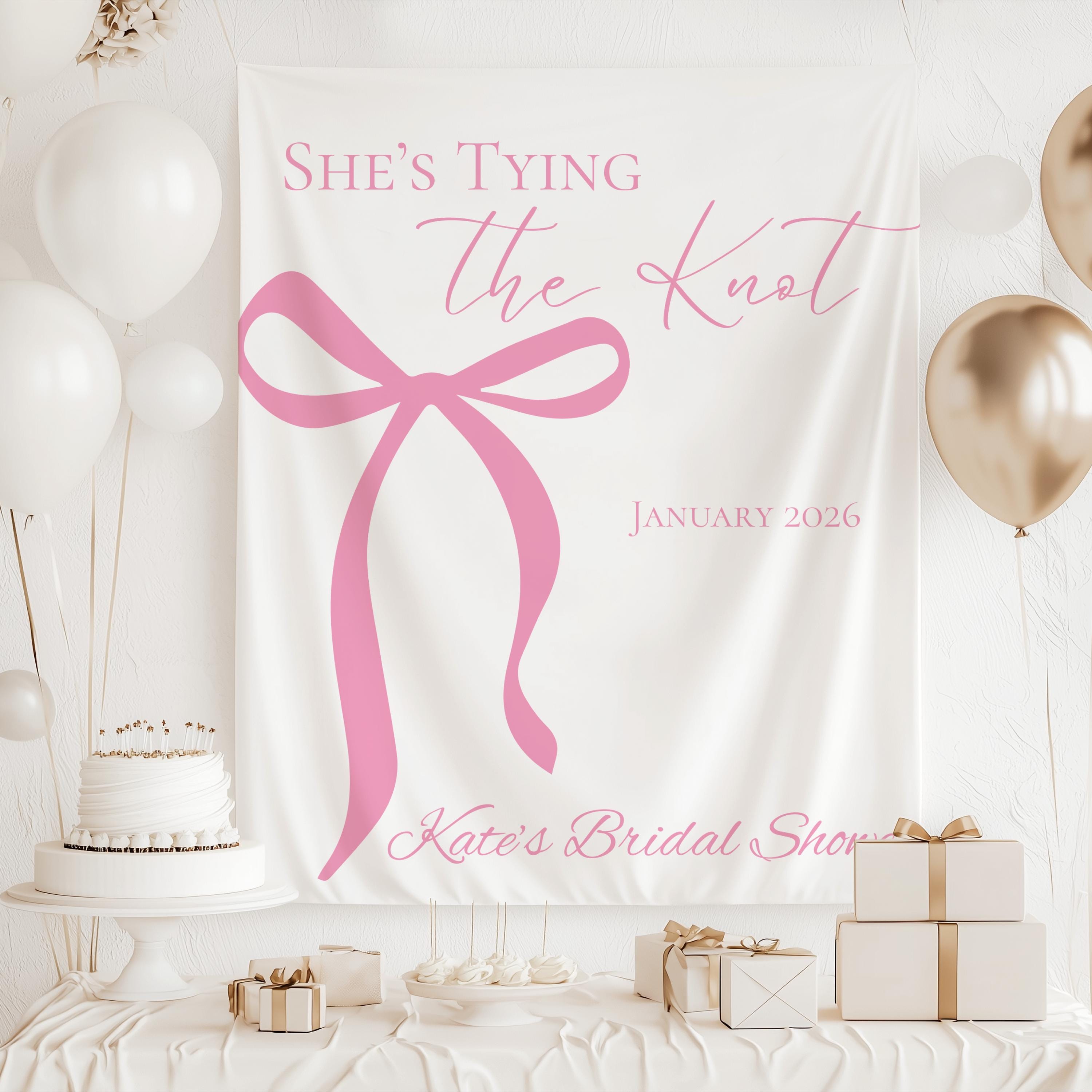Elegant bridal shower backdrop featuring oversized bow artwork and personalized bridal shower details