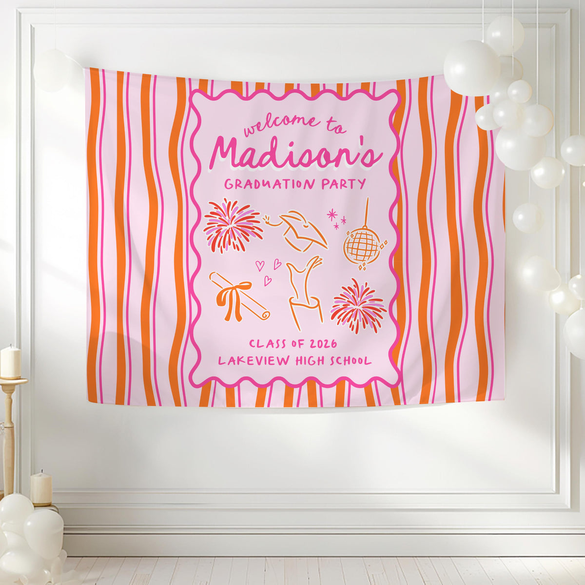 Personalized high school graduation party decor featuring a colorful pink and orange graduation banner