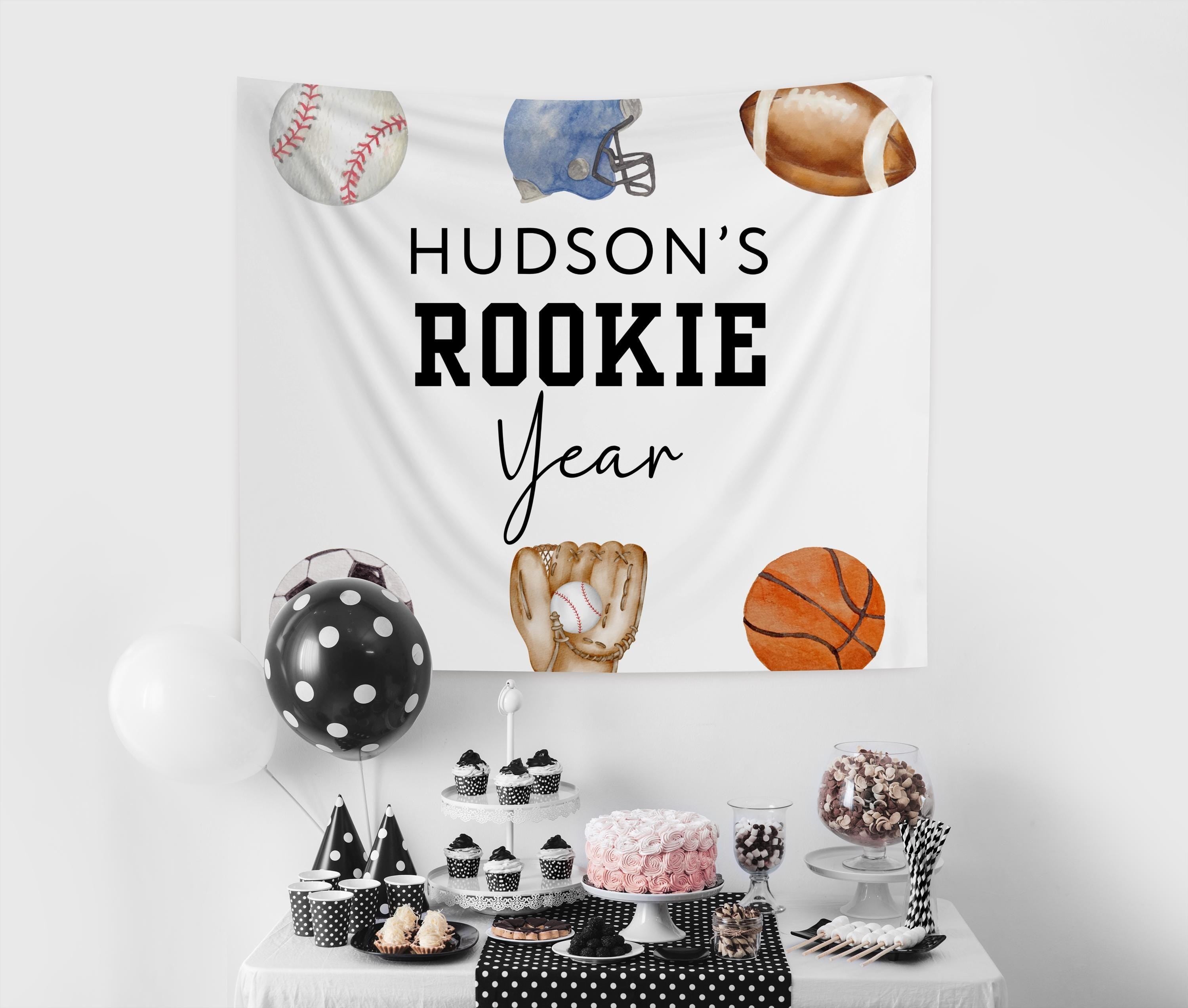 Custom Rookie Year 1st birthday banner featuring baseball football soccer basketball and baseball glove