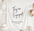 Personalized They're Engaged banner with custom names and engagement date