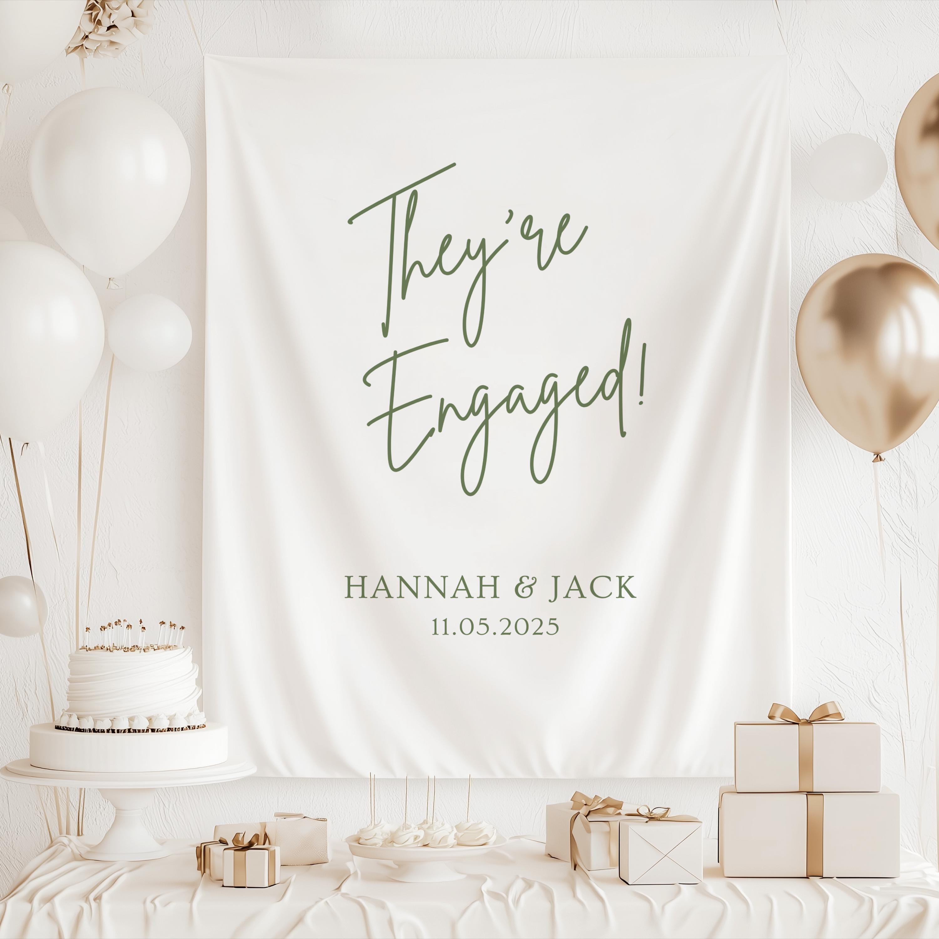 Custom They're Engaged backdrop for engagement party celebrations