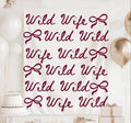 Wild Wild Wife bachelorette banner featuring coquette bows for a western cowgirl bachelorette party backdrop